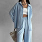 Elegant feminine set consisting of shirt and trousers