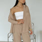 Elegant feminine set consisting of shirt and trousers