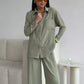 Elegant feminine set consisting of shirt and trousers
